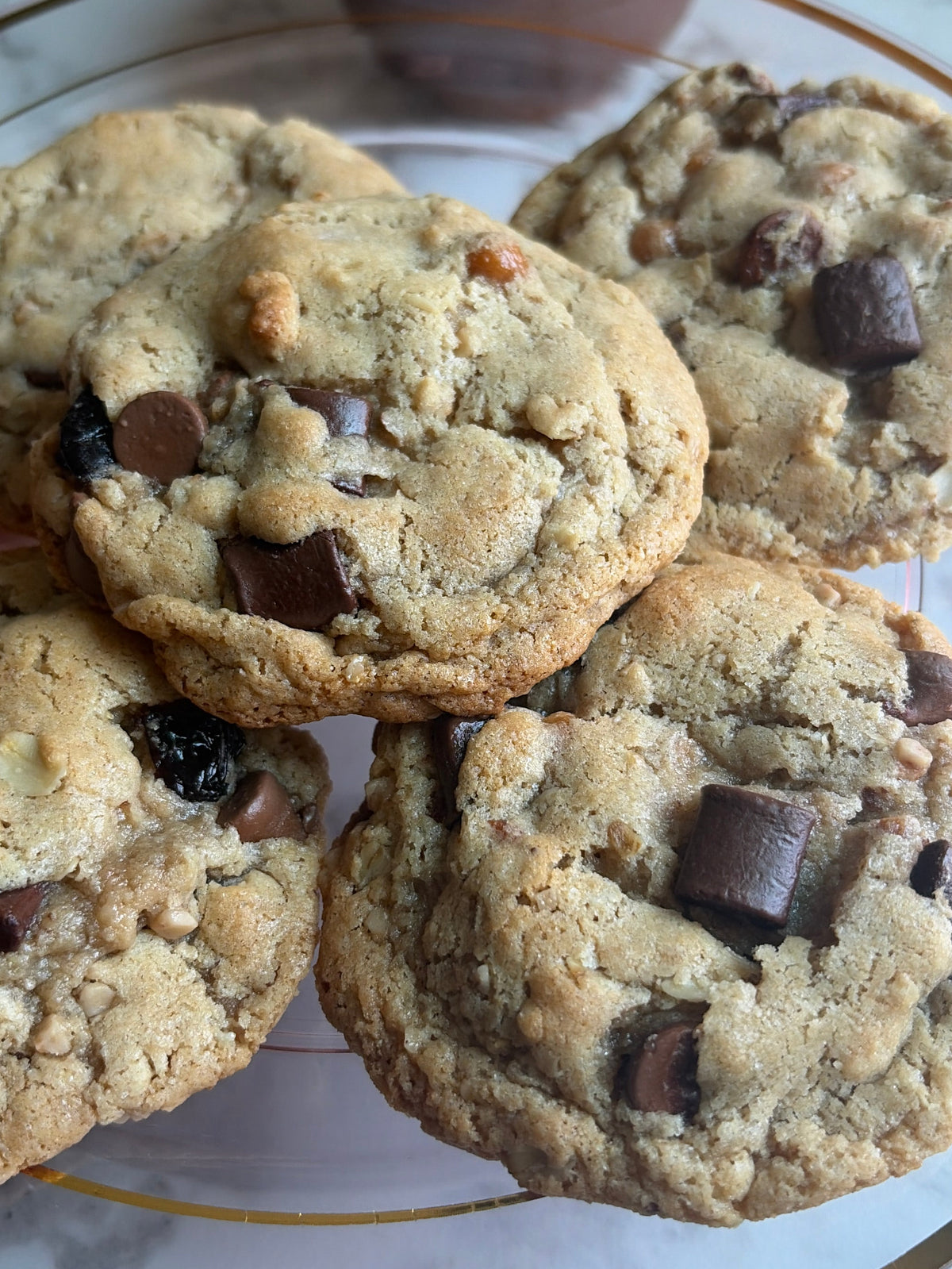 Six baked The Everything cookies on a plate